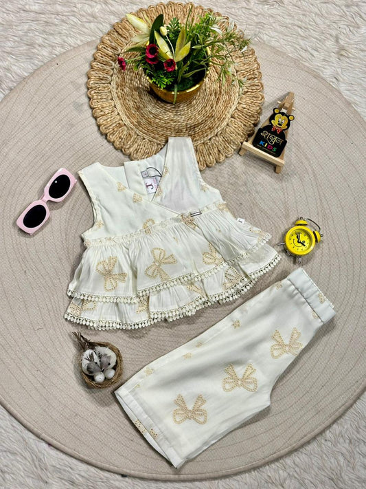 Angelic Beauty: White Embroidered Bow Party Set by SHAGUN FASHION