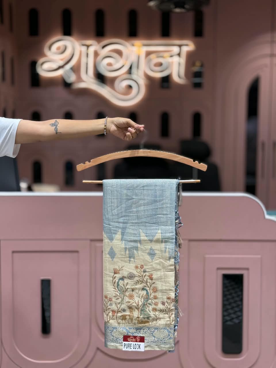 SHAGUN FASHION Pure Look Linen Tissue Saree with Traditional Peacock & Deer Floral Pallu | Elegant Soft Linen Saree with Zari Border & Hanging Tassels
