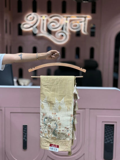 SHAGUN FASHION Pure Look Linen Tissue Saree with Traditional Peacock & Deer Floral Pallu | Elegant Soft Linen Saree with Zari Border & Hanging Tassels